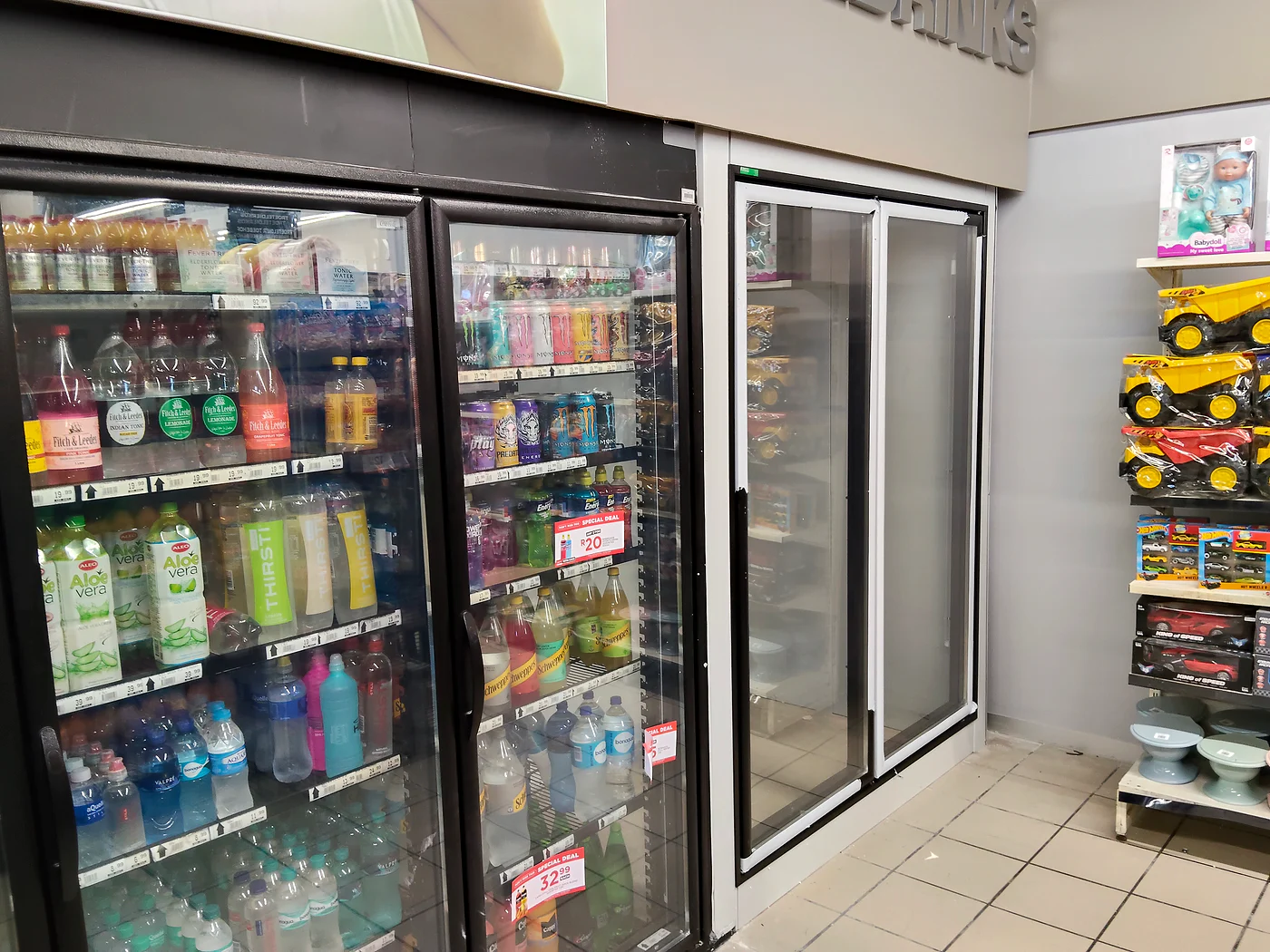 Commercial glass-door drinks fridges in a retail setting
